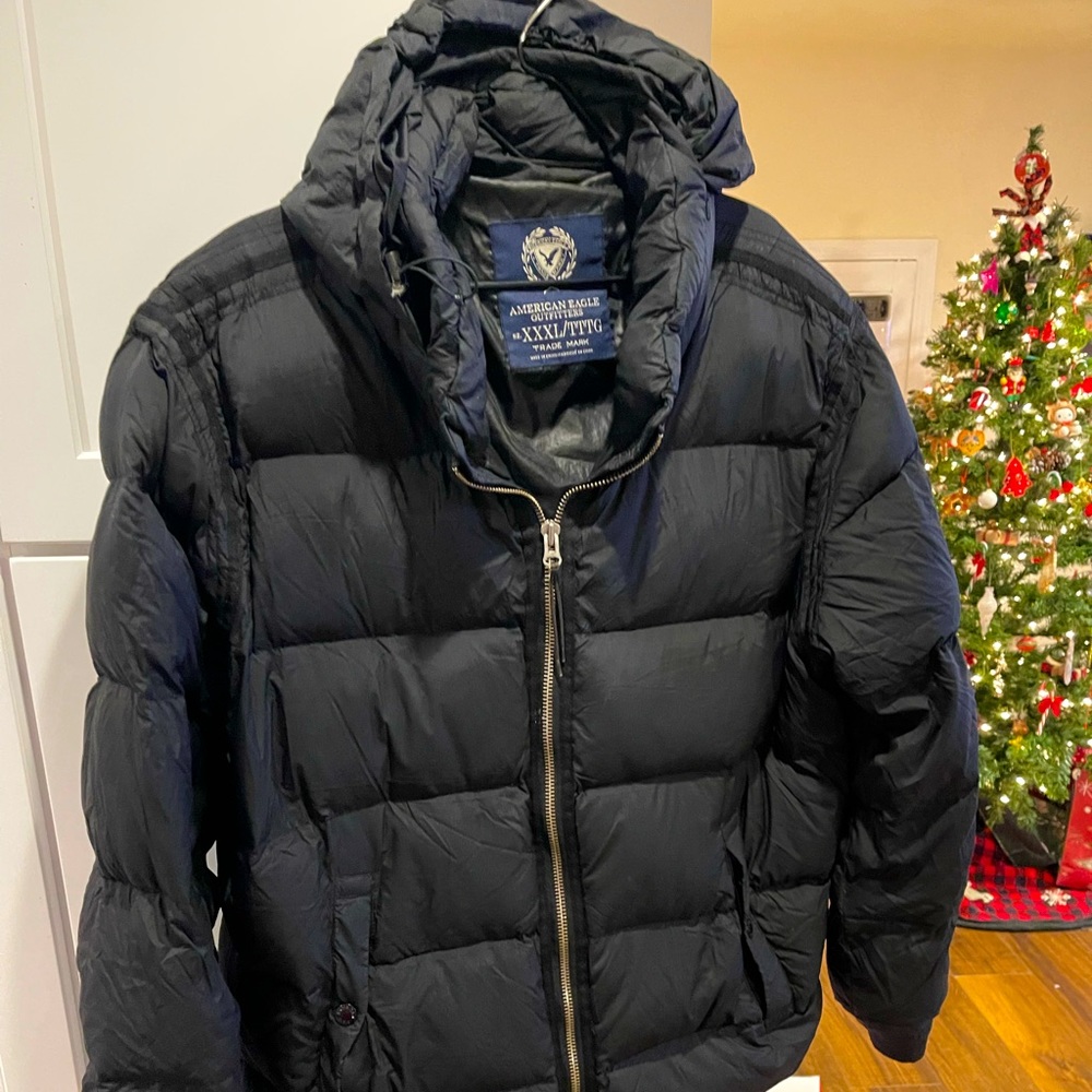 This is an American Eagle Puffer Jacket 3XL in good used condition.